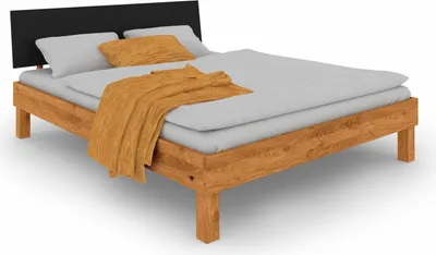 Produktbild von Bett Zigo 2 aus Wildeiche massiv 100x200 Kopfteil aus MDF Schwarz und Holzbeine