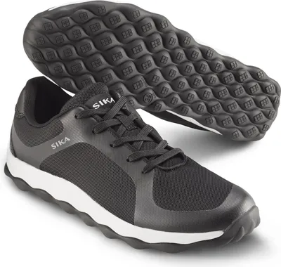 A pair of black Sika sneakers with white soles, shown from a slightly elevated angle with the sole of one shoe visible.