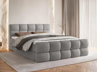 A bedroom setting with a bed.