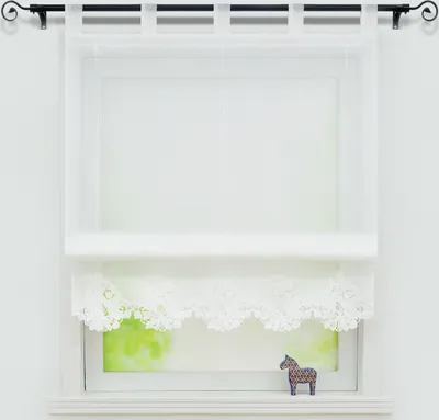 A white sheer curtain with lace trim hangs in front of a window with a blurry green view outside. A small decorative horse figurine sits on the windowsill.