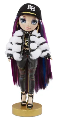 A doll standing on a gold display stand.