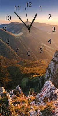 Produktbild von Wallario Design Wanduhr Berglandschaft mit Sonnenuntergang in der Slowakei aus Echtglas, Größe 30 x 60 cm