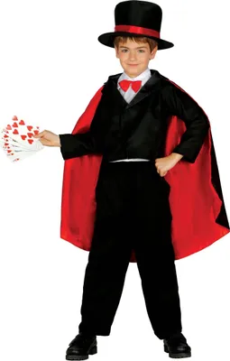 A young boy dressed as a magician, holding playing cards.