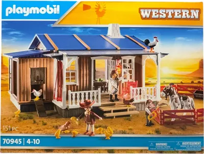 The image shows the packaging of a Playmobil Western ranch playset.