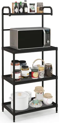 A black metal kitchen rack with a microwave and various jars and containers on its shelves.