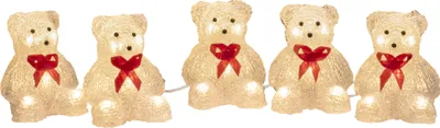 A string of five illuminated teddy bear figures.