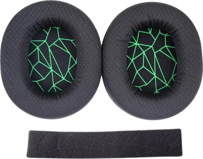 Two black ear pads with a green geometric pattern and a black headband pad are laid out on a white background.