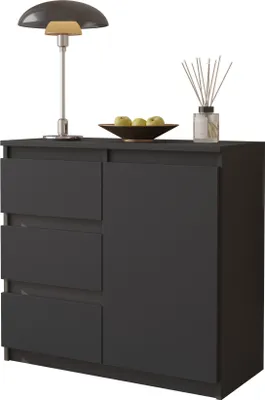 A dark gray sideboard with three drawers on the left and a door on the right, placed on a white background. A lamp, a bowl of apples, and a diffuser are on top.