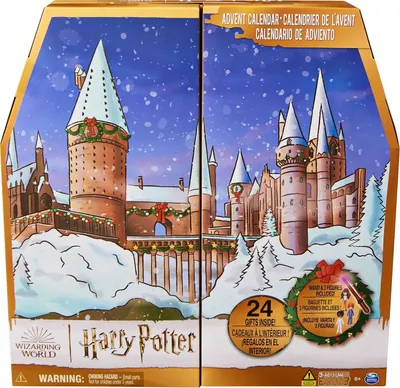 The image shows the front of a Harry Potter themed advent calendar box, decorated with a winter scene of Hogwarts castle.