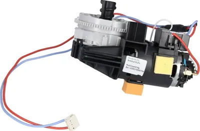 A close-up studio shot of a coffee machine grinder assembly with attached wires and a small label.