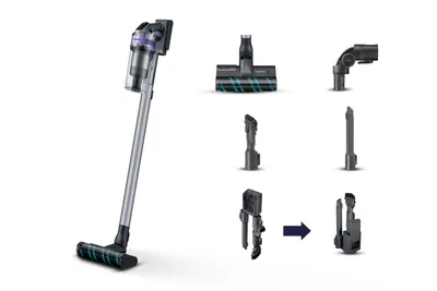 A cordless vacuum cleaner with various attachments displayed around it.