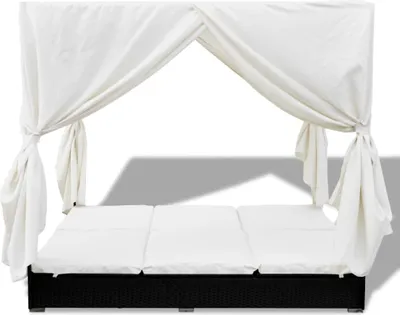 A white canopy outdoor lounge bed with a black base.
