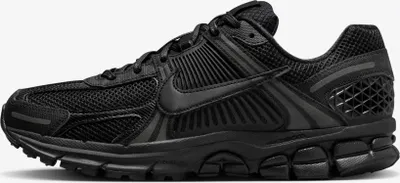 A black Nike Zoom Vomero 5 sneaker shown from the side against a white background.