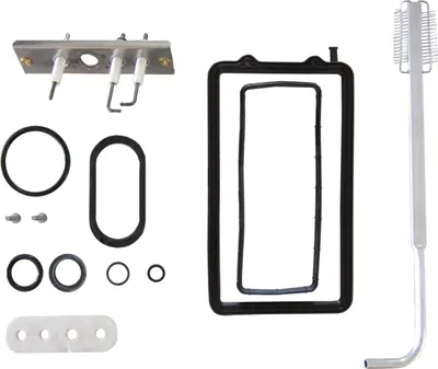 A collection of spare parts for a BOSCH appliance, including igniters, gaskets, and a cleaning tool.