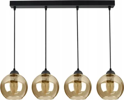 A black linear chandelier with four amber glass globe shades.