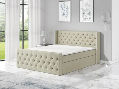 A bedroom scene with a bed as the main focus.