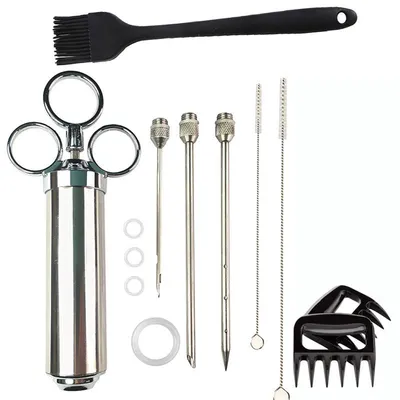 A collection of barbecue tools laid out on a white background.