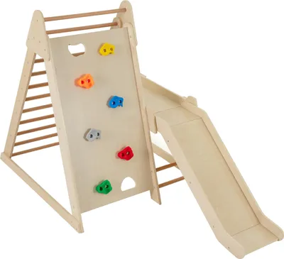 A wooden indoor climbing structure for children, featuring a climbing wall with colorful holds, a ladder, and a slide.