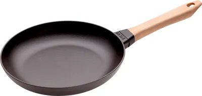 A black cast iron frying pan with a light brown wooden handle, shown from a diagonal angle against a white background.