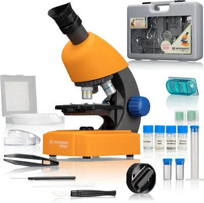 A microscope and its accessories are displayed on a white background.