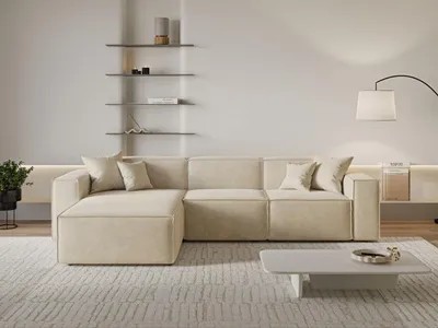 A modern living room with a sectional sofa, shelves, and a coffee table.