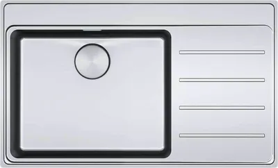 A top-down view of a stainless steel kitchen sink with a drainboard.