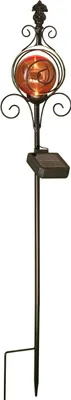 A solar-powered garden stake with an ornate top featuring a glass orb.