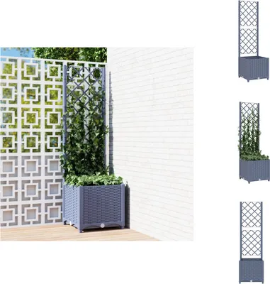A dark gray planter with a trellis, filled with green plants, stands on a wooden deck next to a white patterned wall and a white brick wall.
