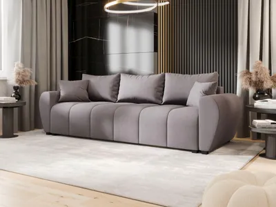 A modern living room with a gray sofa, curtains, and decorative elements.
