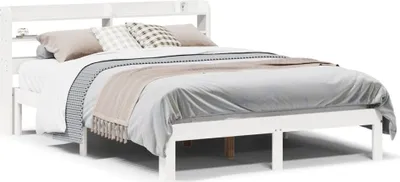 A white bed frame with a headboard and pillows on a white background.
