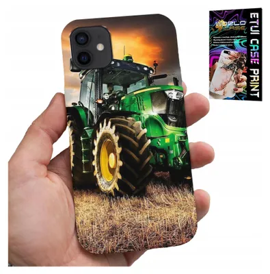 A hand holding a smartphone case with a tractor image on it, with a small packaging image in the background.
