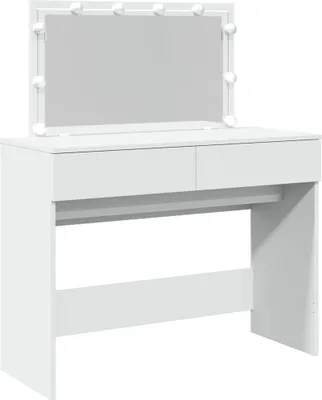 A white vanity table with a lighted mirror.