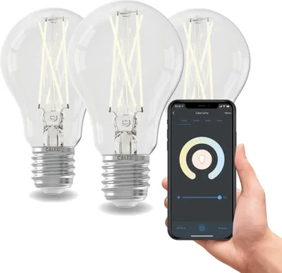 A hand holding a smartphone displaying a smart lamp app, with three smart LED bulbs in the background.
