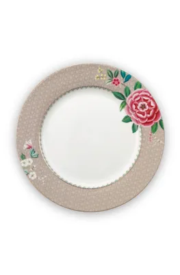 A single plate with a floral design on a white background.