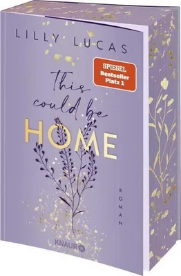 A book cover with floral design and gold accents.