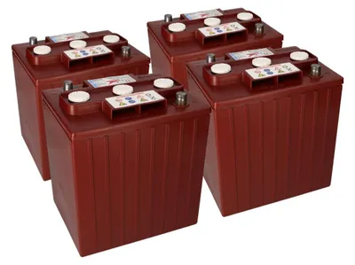 Four deep cycle batteries are arranged in a diagonal formation on a white background.