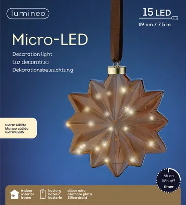 A star-shaped decoration light with micro-LEDs, hanging from a ribbon. The packaging information is visible on the left and bottom.