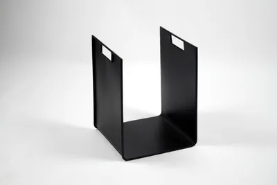 A black metal firewood rack is shown against a white background.