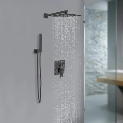 A modern shower system with a rain showerhead and handheld showerhead is shown in a bathroom.