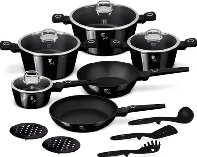 A collection of black cookware and kitchen utensils arranged on a white background.