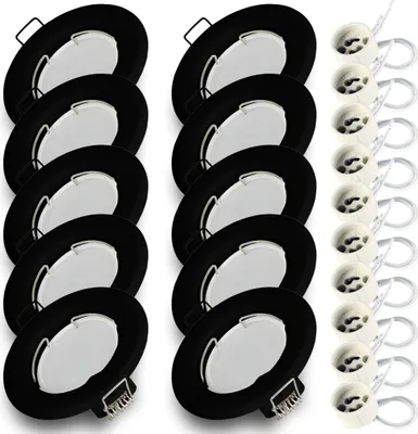 A set of black round recessed light fixtures with white centers, arranged in two columns.
