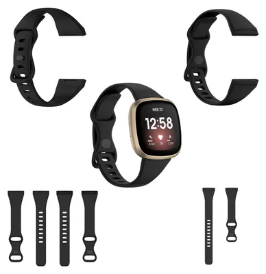 A collection of black watch bands and a smartwatch with a gold casing and a black band, displayed against a white background.