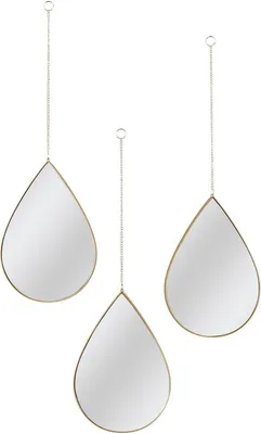 Three teardrop-shaped mirrors with gold frames hang from chains against a white background.