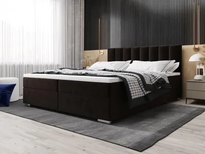 A bedroom setting with a bed as the main focus.