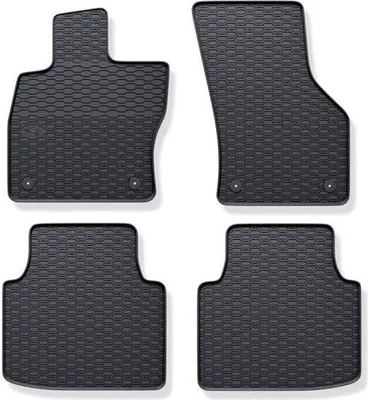 A set of four black rubber car floor mats with a honeycomb pattern, arranged on a white background.