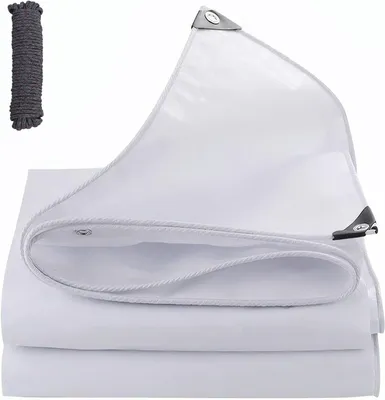 A white tarp folded and partially unfolded, with a rope bundle to the side.