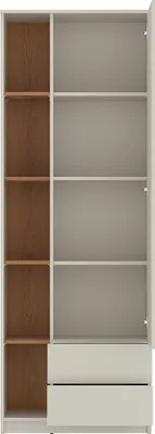 An empty wardrobe with shelves and drawers.