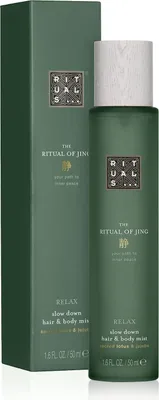 A green bottle of Rituals Jing Hair & Body Mist and its matching green box.