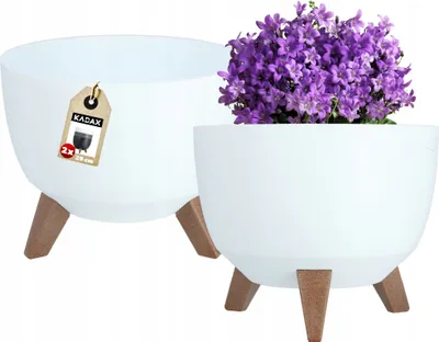 Two white planters with wooden legs are shown, one with purple flowers.