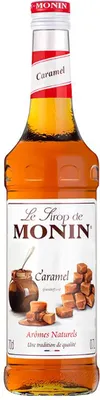 A bottle of Monin Caramel syrup.
